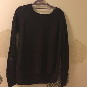 Warm purple sweater with crotchet sleeves.