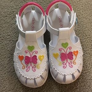White sandals with heart/butterfly details