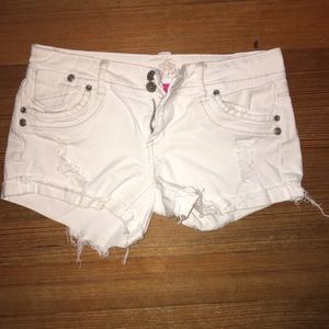 Destroyed white denim shorts