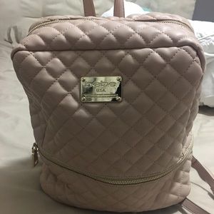 bebe backpack in nude/light mauve color.