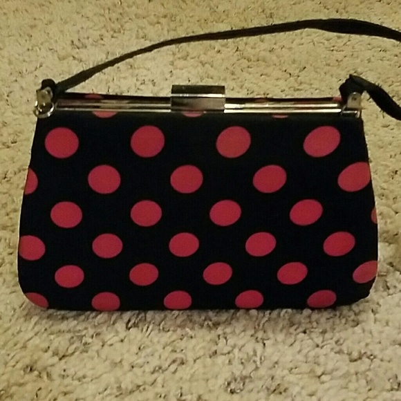 Got pink and black polkadot clutch