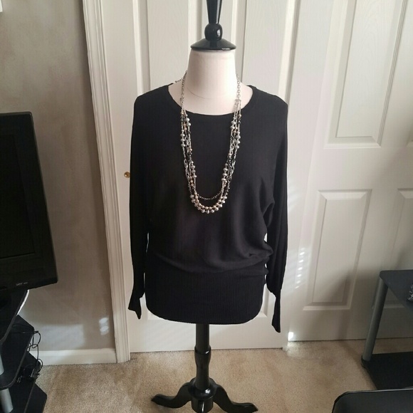 Black dolman sleeve sweater.