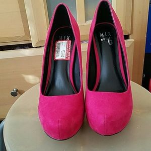 Pink suede pumps