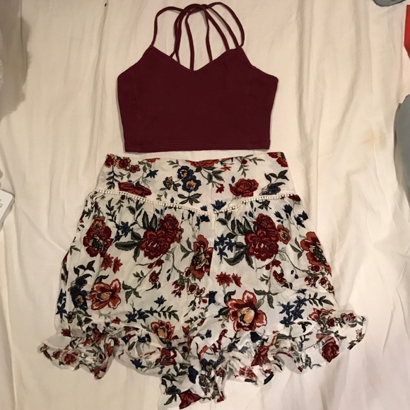 Floral shorts with a maroon crop top/bralette
