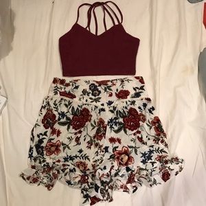 Floral shorts with a maroon crop top/bralette