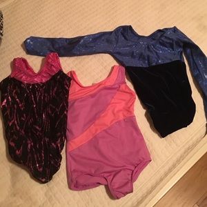 Three gymnastic leotards