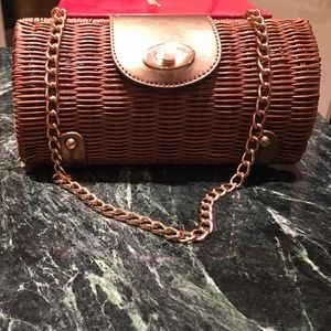 Woven cognac and gold clutch.