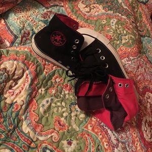 Black Converse High Tops, pink & purple inside.