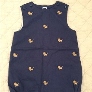 J&J blue onesie w/ lions