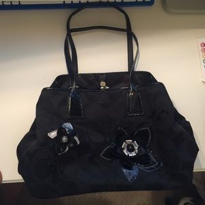 Authentic Black coach purse with flower appliqué