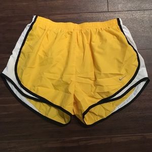 Large yellow Nike running shorts