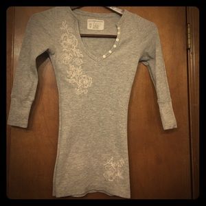 gray long sleeve t-shirt w/ floral embellishments