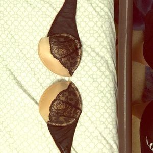 Nude and black strapless bra.