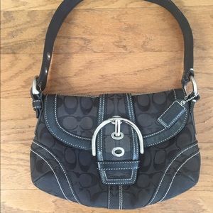 Black Coach Soho buckle-flap bag