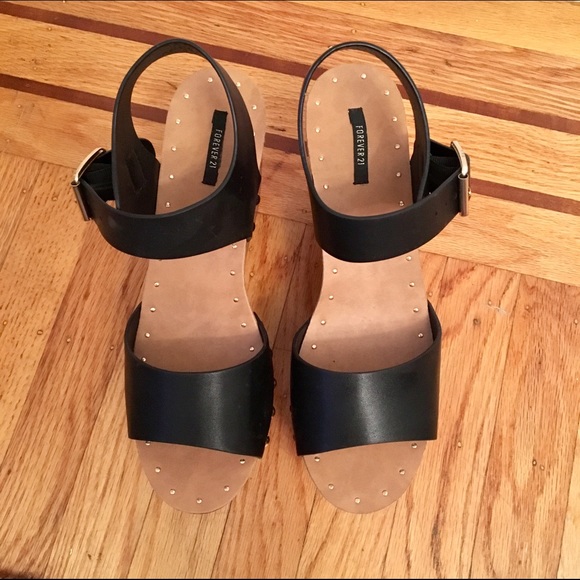 Black platform sandals with gold detail