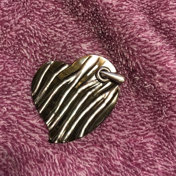 Mother of pearl heart pendant 2" in height.