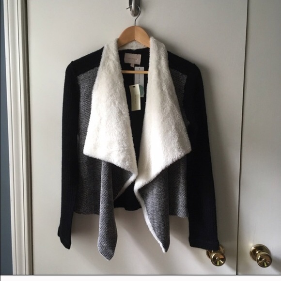 Cozy and flattering sweater by skies are blue