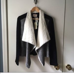 Cozy and flattering sweater by skies are blue