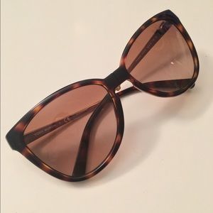 Tory Burch sunglasses and case.