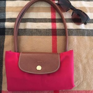 Authentic Red Longchamp Le Pliage tote.