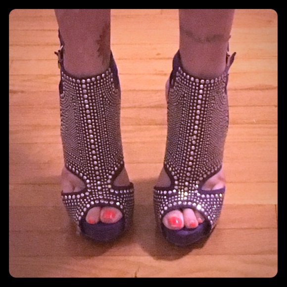 Brand new, never been worn, purple stilettos