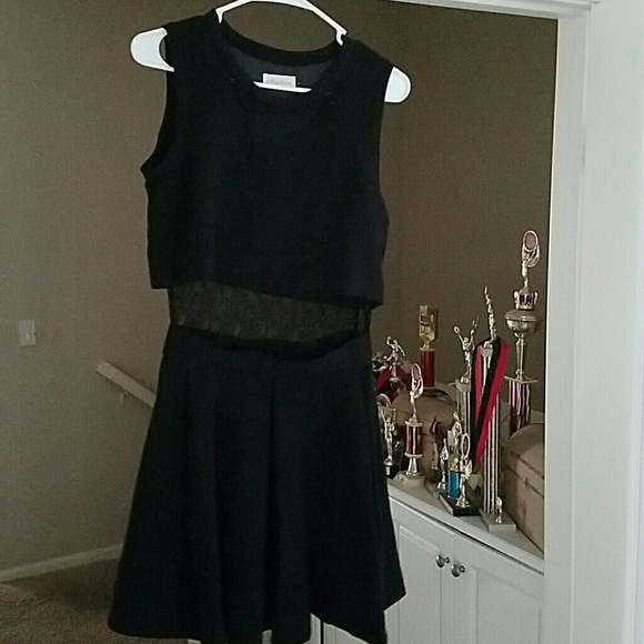 Beautiful black dress with lace embellishment.