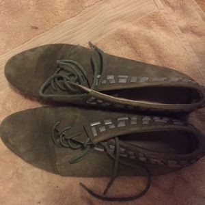 Flat mid-ankle height booties with grey stones.