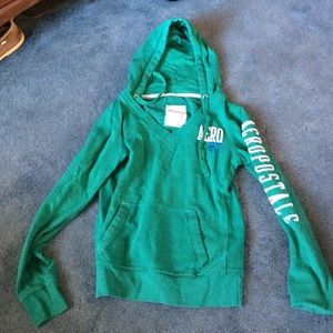 V-neck hoodie with brand logo in sleeve
