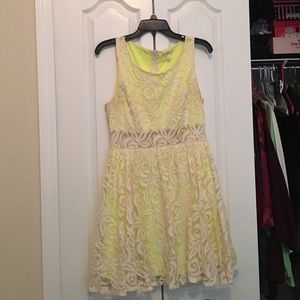 Lace dress with mid drift peek through