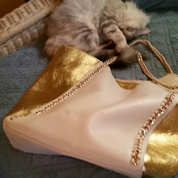 High fashion purse, soft leather with gold tone.