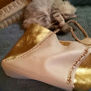 High fashion purse, soft leather with gold tone.