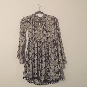 Boho dress will bell sleeves and open back