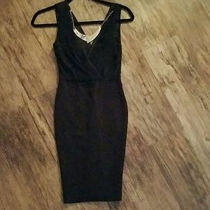 Black bodycon dress with snake and gold necklace
