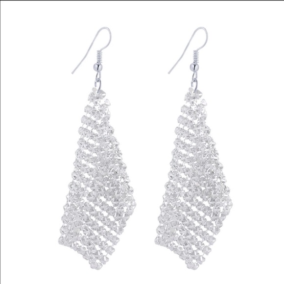 Bohemian style long silver earrings.