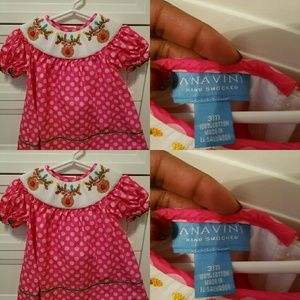 A pink reindeer smocked dress
