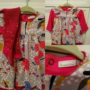 A gilrs Catimini dress with tights