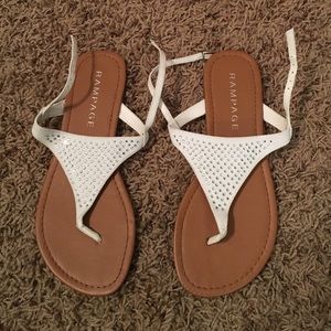 2 pair of white sandals.