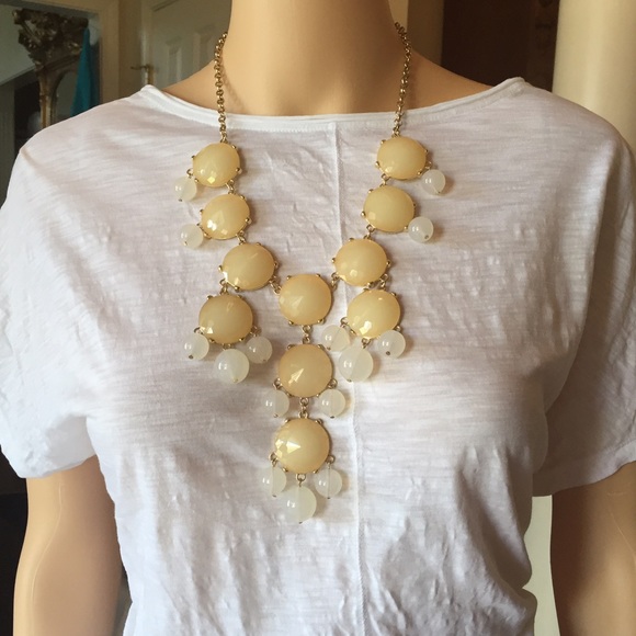 Creamy white/pearlescent bobble necklace.
