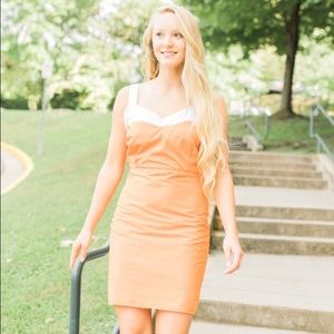 Orange and white dress.