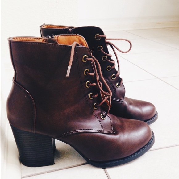 Brown lace up ankle bootie w/ high heel.