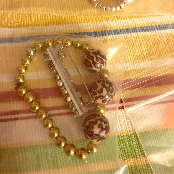 Hand made jewelry and pins by Amina