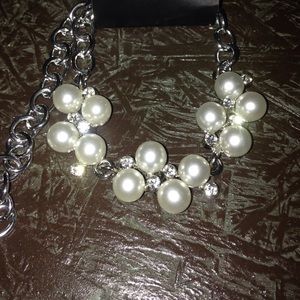 silver with white pearls and little diamonds