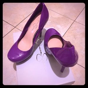 Purple round toe pumps.