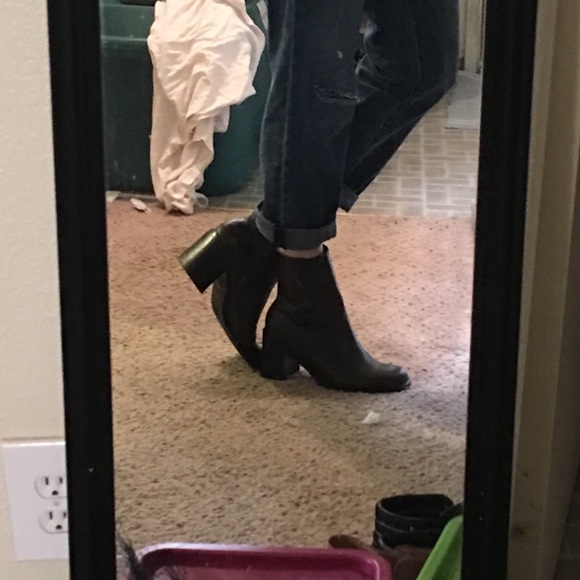 Dark brown leather Chelsea boots.