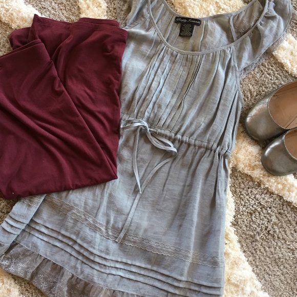 Grey tank with lace ruffles.