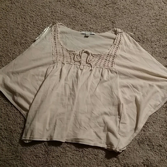 Shirt with long loose sleeves.