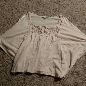 Shirt with long loose sleeves.