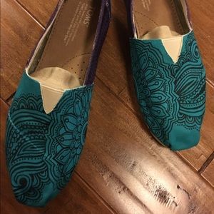 Toms hand drawn and painted shoes.