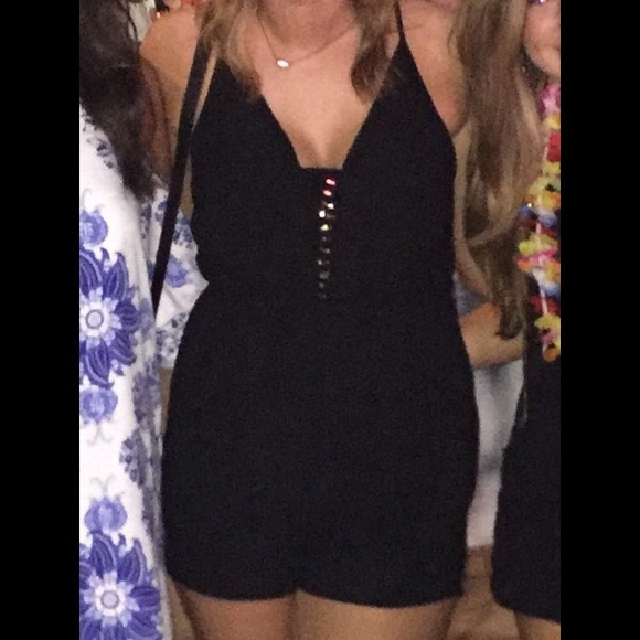 Black romper with gold accents