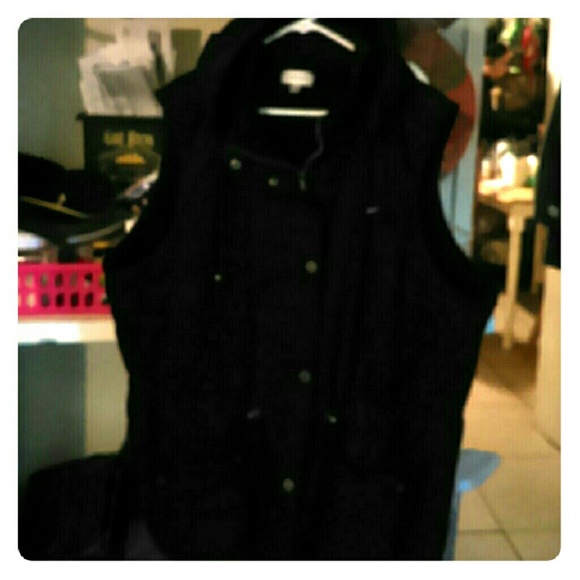 Black winter vest with hood.